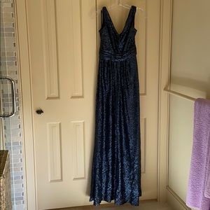 Long formal blue sequin gown.
